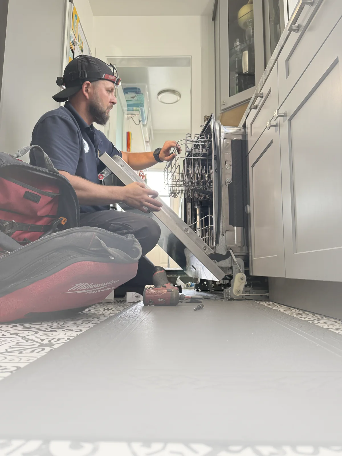 UKS PRO technician inspecting a dishwasher